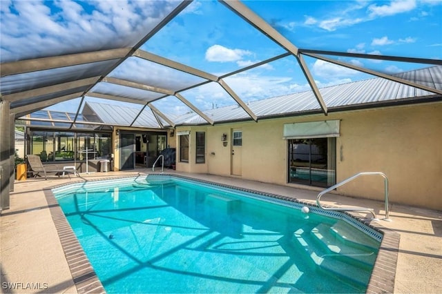 view of pool featuring a patio and a lanai