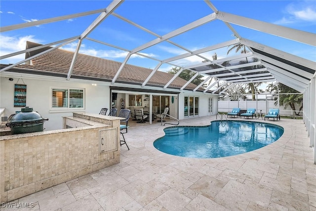 view of pool featuring area for grilling, an outdoor living space, glass enclosure, a patio, and an outdoor bar