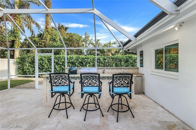 view of patio with glass enclosure