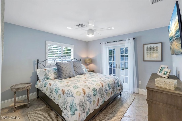 tiled bedroom featuring ceiling fan and french doors