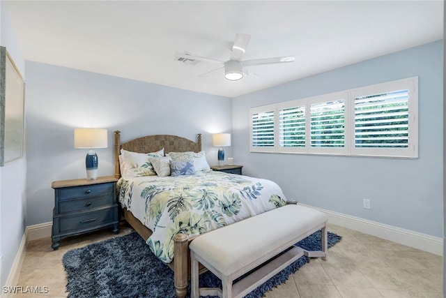 tiled bedroom featuring ceiling fan