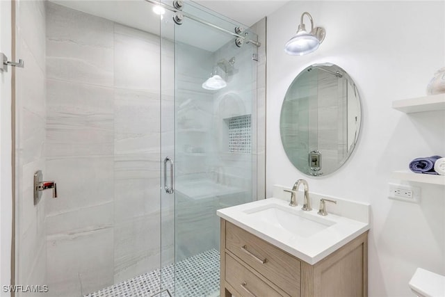 bathroom with vanity and walk in shower