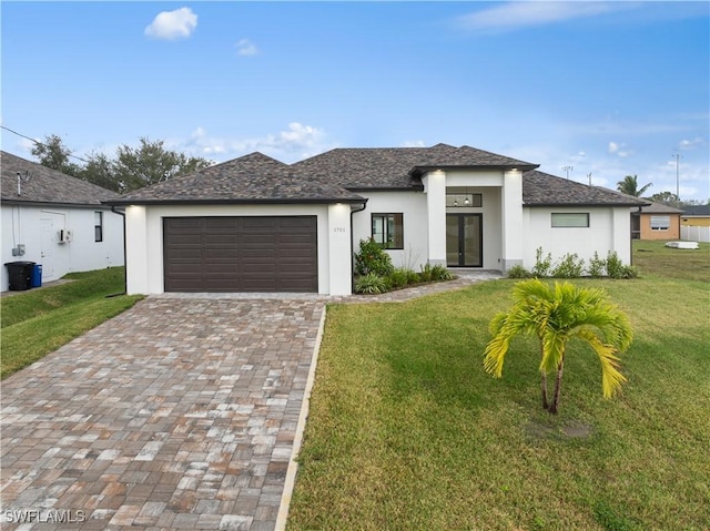 view of front of house featuring a front lawn and a garage