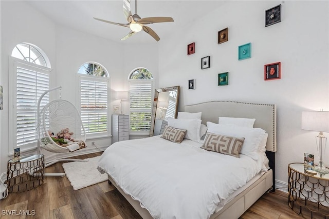 bedroom with hardwood / wood-style flooring and ceiling fan