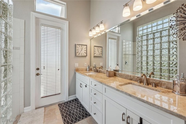 bathroom with tile patterned flooring and vanity