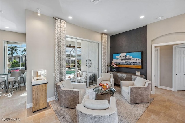 living room with ceiling fan