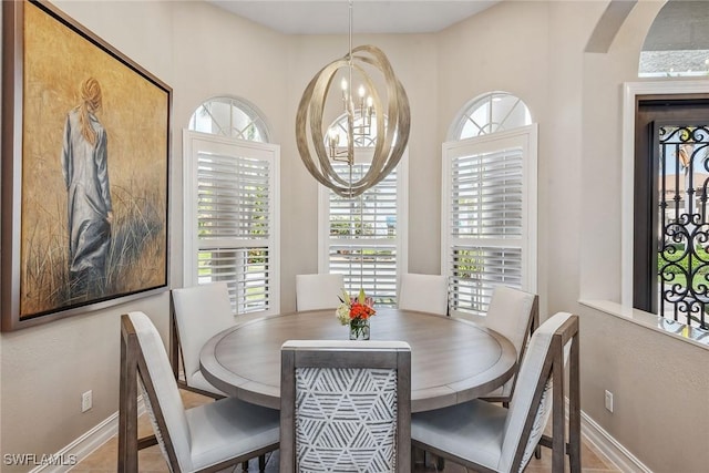 dining area featuring an inviting chandelier