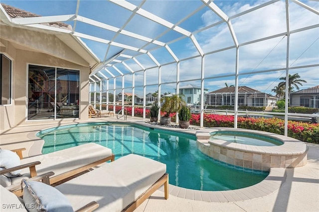 view of pool featuring an in ground hot tub, a patio, and a lanai