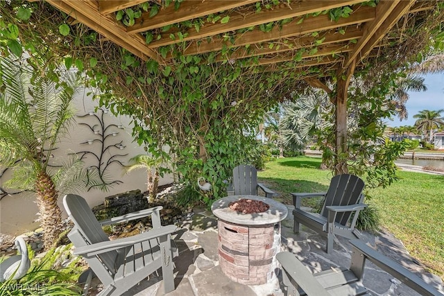 view of patio featuring an outdoor fire pit