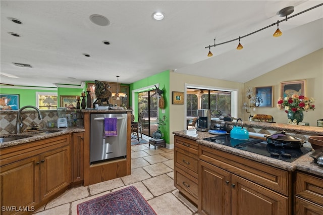 kitchen with a wealth of natural light, dishwasher, and stone countertops