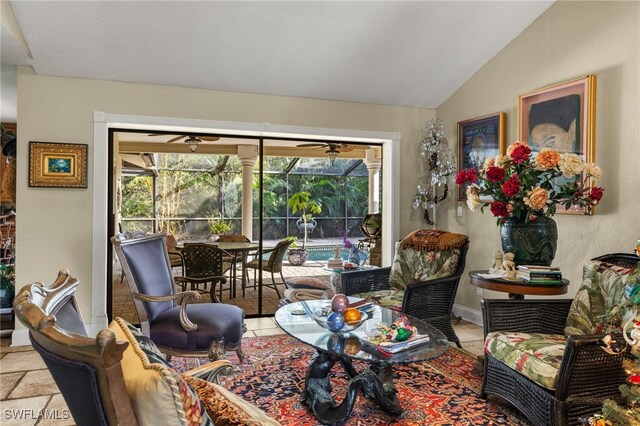 sitting room with lofted ceiling