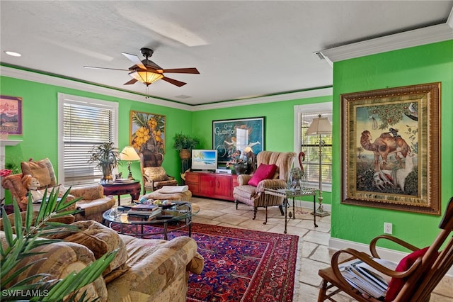 living room with ceiling fan and crown molding