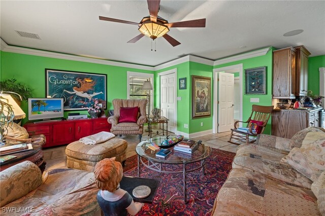 living room with light tile patterned floors, ceiling fan, and crown molding