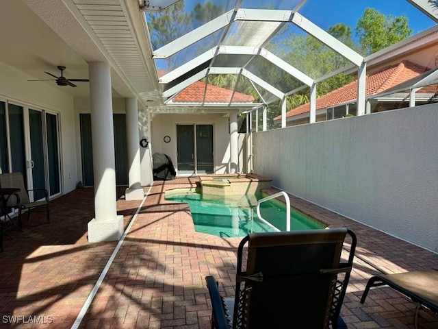 view of patio / terrace featuring a lanai and ceiling fan