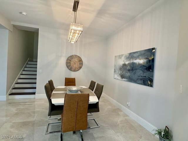 dining room with a notable chandelier