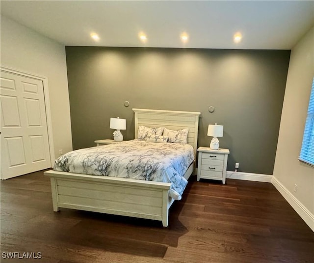 bedroom featuring dark hardwood / wood-style floors