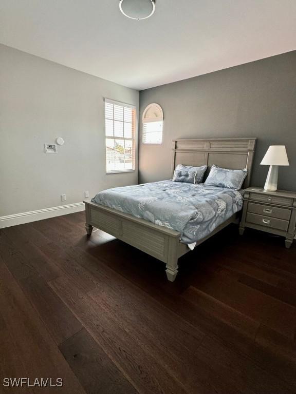 bedroom featuring dark wood-type flooring