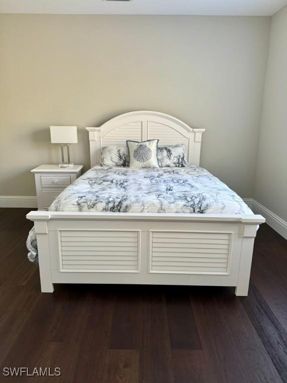 bedroom featuring dark wood-type flooring