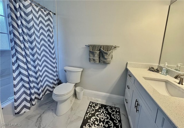 bathroom with walk in shower, vanity, and toilet