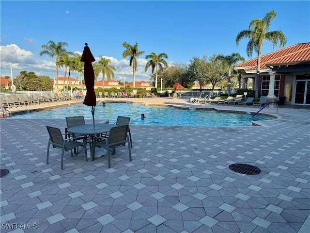 view of swimming pool featuring a patio area