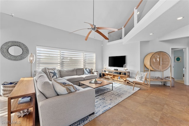 living room featuring high vaulted ceiling and ceiling fan