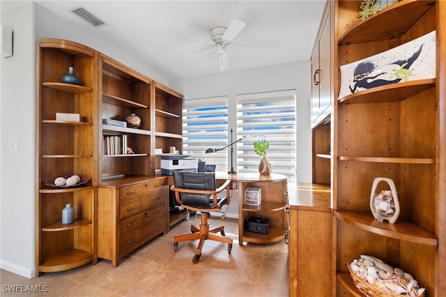 tiled office space with ceiling fan