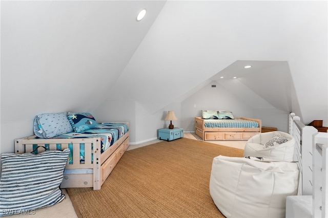 bedroom featuring light carpet and vaulted ceiling