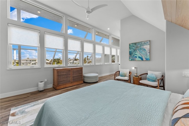 bedroom featuring ceiling fan, vaulted ceiling, and hardwood / wood-style flooring