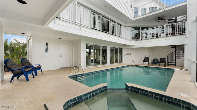 view of pool featuring ceiling fan