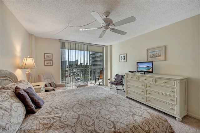 carpeted bedroom featuring ceiling fan, floor to ceiling windows, access to exterior, and a textured ceiling