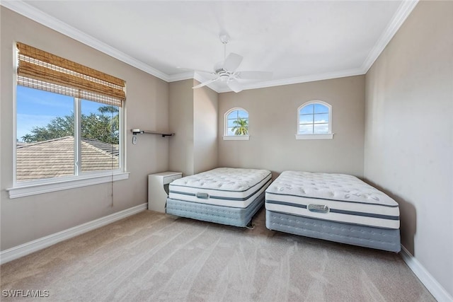 carpeted bedroom featuring ceiling fan and ornamental molding