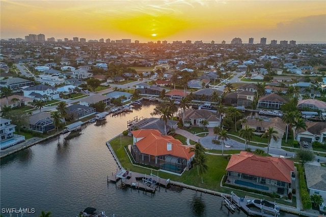 aerial view at dusk with a water view