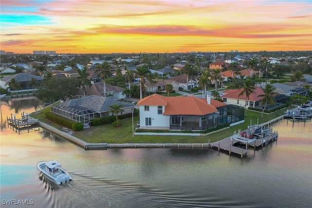 aerial view at dusk with a water view