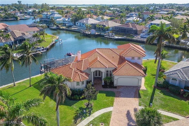 birds eye view of property featuring a water view