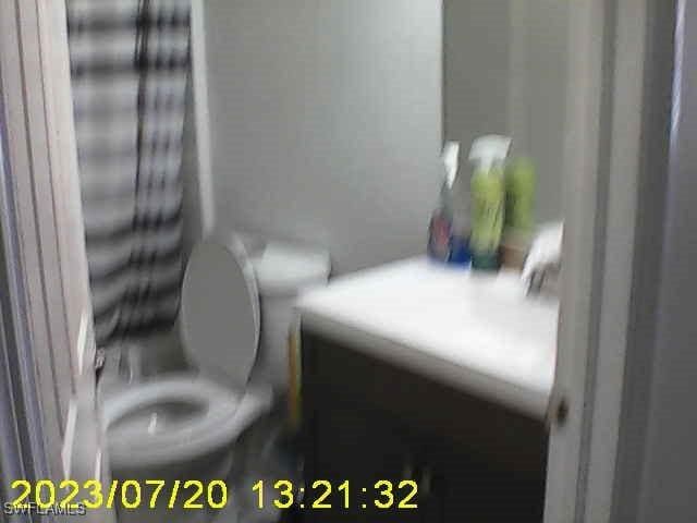 bathroom featuring vanity and toilet