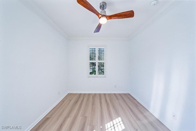 empty room with ornamental molding and light hardwood / wood-style flooring