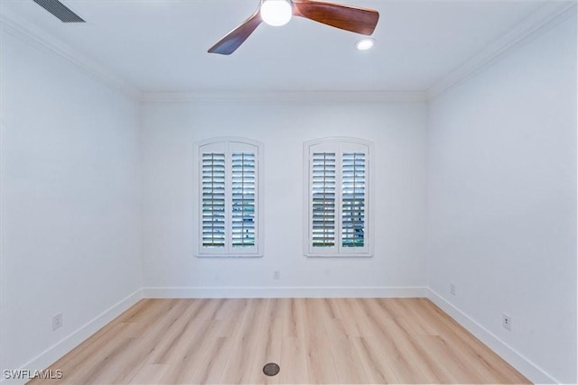 spare room featuring ceiling fan, crown molding, and light hardwood / wood-style flooring