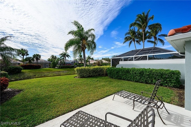 view of yard featuring a lanai and a patio