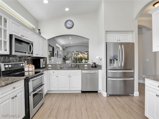 kitchen featuring white cabinetry, stainless steel appliances, and sink