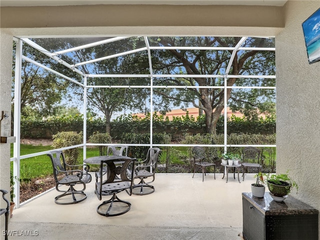 view of patio / terrace with a lanai