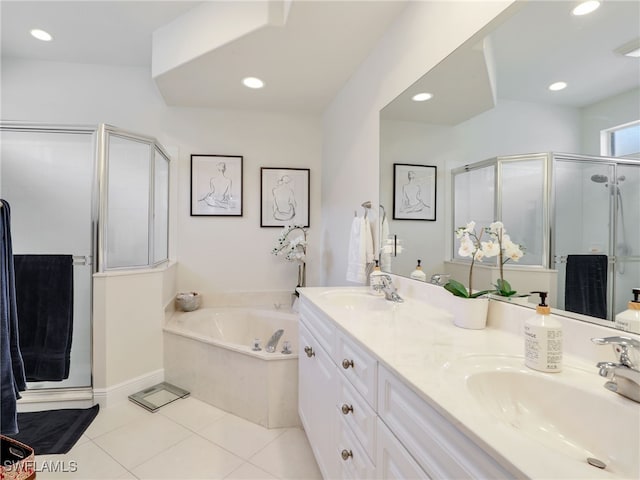 bathroom with vanity, tile patterned floors, and plus walk in shower