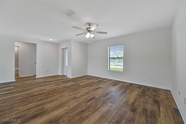 unfurnished room featuring ceiling fan and dark hardwood / wood-style flooring