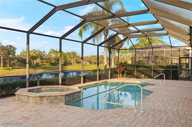 view of pool featuring a patio, a water view, and glass enclosure