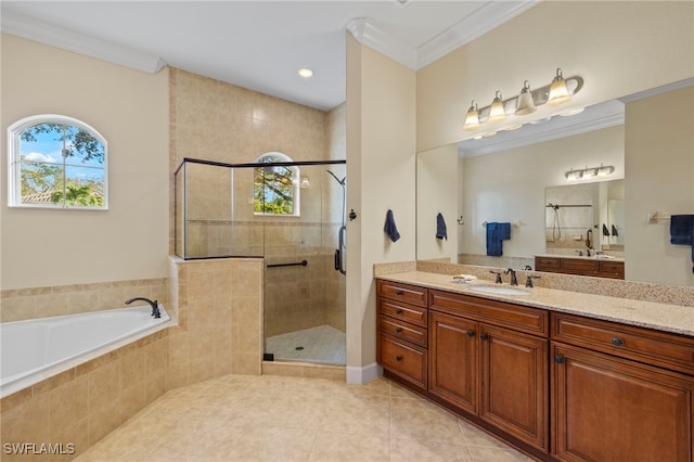 bathroom with tile patterned floors, separate shower and tub, crown molding, and vanity