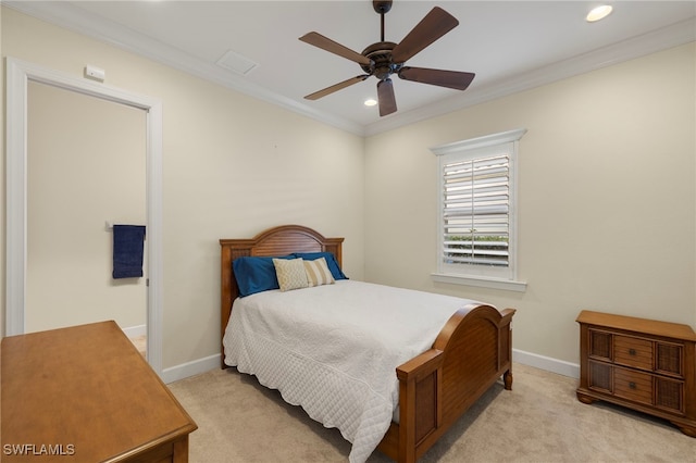 bedroom featuring ceiling fan, crown molding, and light carpet