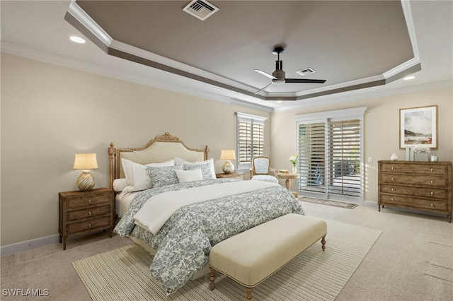 carpeted bedroom with a raised ceiling, ceiling fan, ornamental molding, and access to outside