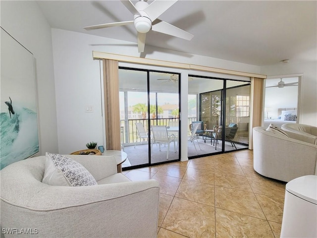 tiled living room with ceiling fan