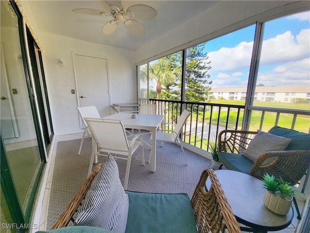 sunroom / solarium with ceiling fan