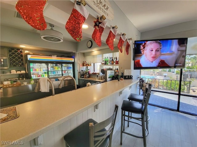 bar featuring hardwood / wood-style floors