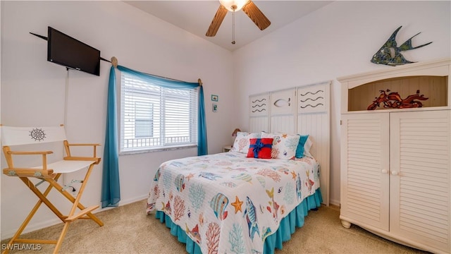 bedroom with ceiling fan and light carpet